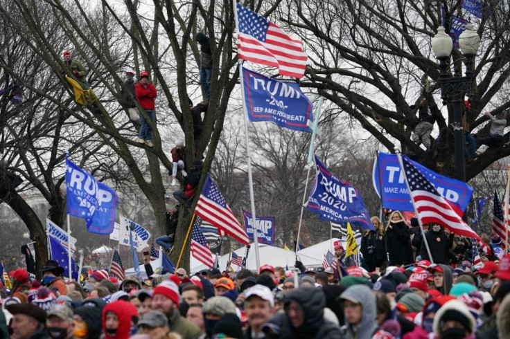 Crowds of people gather as US President Donald Trump speaks to supporters before Congress meets to certify Joe Biden's election win