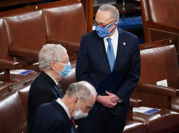 Top Senate Democrat Chuck Schumer stands with Senate Republican leader Mitch McConnell in a session to certify Joe Biden's election victory