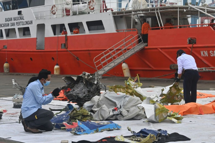 Indonesian investigators are combing through the wreckage of the crashed Sriwijaya Air 737 to try and explain why it went down