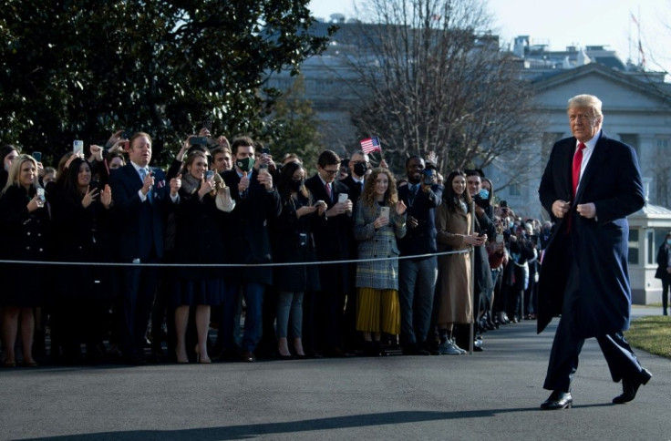 US President Donald Trump walks by supporters outside the White House on January 12, 2021 in Washington, DC before his departure to Alamo, Texas
