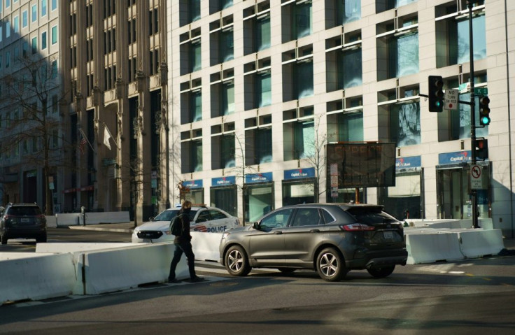 Security officials set up concrete road blocks at the intersection of 15th and and the busy K Street NW, just blocks from the White House