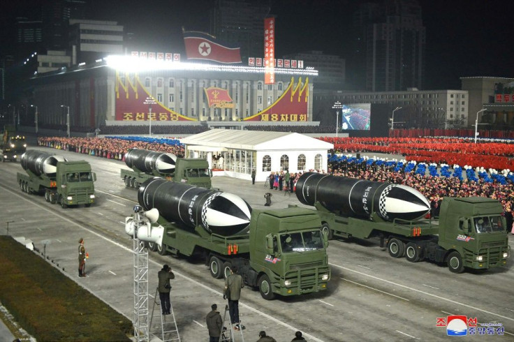 Pictures showed at least four of the SLBMs with black-and-white cones being driven past flag-waving crowds in Kim Il Sung Square