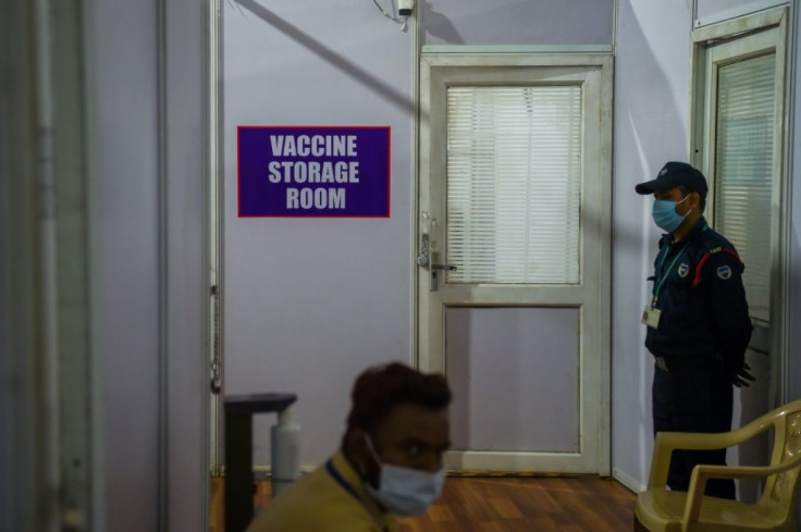 Security stands guard outside a Covid-19 vaccine storage room at a centre in Mumbai on January 15, 2021