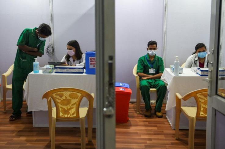 Medical staff work inside a Covid-19 vaccination centre in Mumbai on January 15, 2021 amid concern a new virus wave might hit, fuelled by a string of recent mass religious festivals