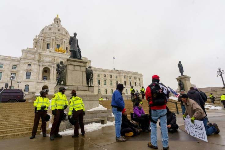 Supporters of US President Donald Trump gather outside the Capitol building in St Paul, Minnesota on January 16, 2021 amid a heavy security presence