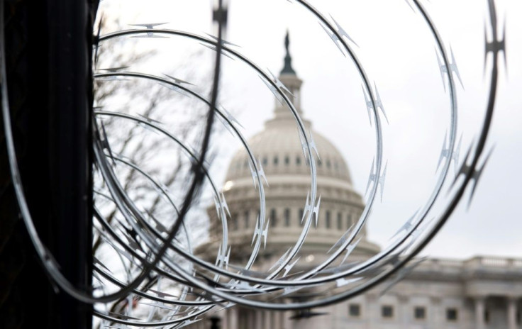 Razor wire is installed on the top of a security fence surrounding the US Capitol in Washington, DC ahead of Joe Biden's inauguration