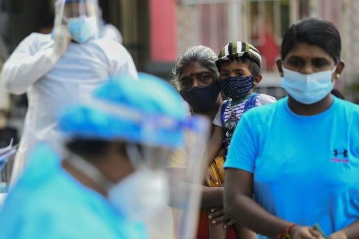 Residents wait in a line to get tested for the coronavirus in Colombo in early January. There has been a resurgence of infections in the country