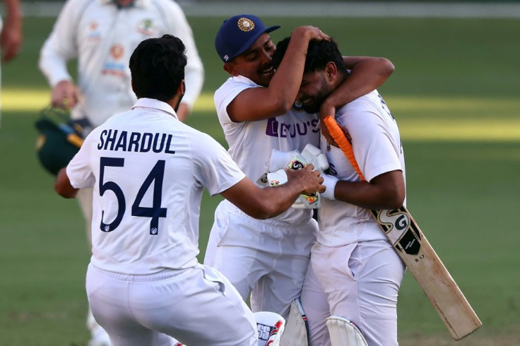 India's players rushed to congratulate Rishabh Pant (R)