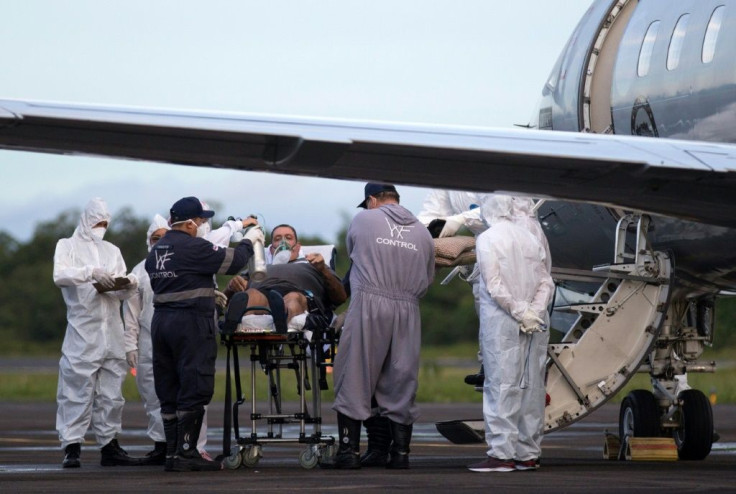 A Covid-19 patient awaiting transfer via a military flight from Manaus