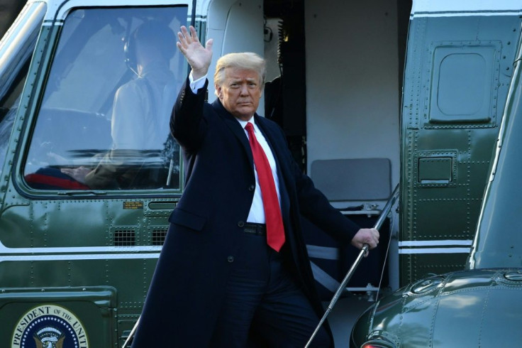 US President Donald Trump waves as he boards Marine One at the White House for the final time