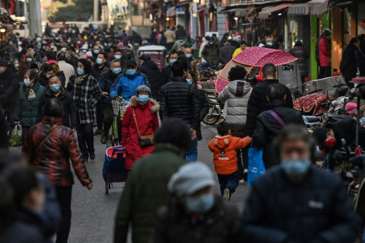 The new normal in Wuhan is much like the old reality; cars buzz down highways, sidewalks bustle with shoppers and public transport is busy