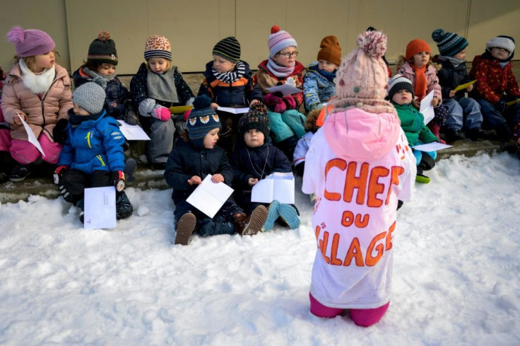 Hand-painted T-shirts identify the village chiefs