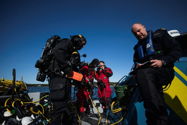 Coastguard officer Patrik Dahlberg, right, says his team are unused to this kind of work -- but they understand its value