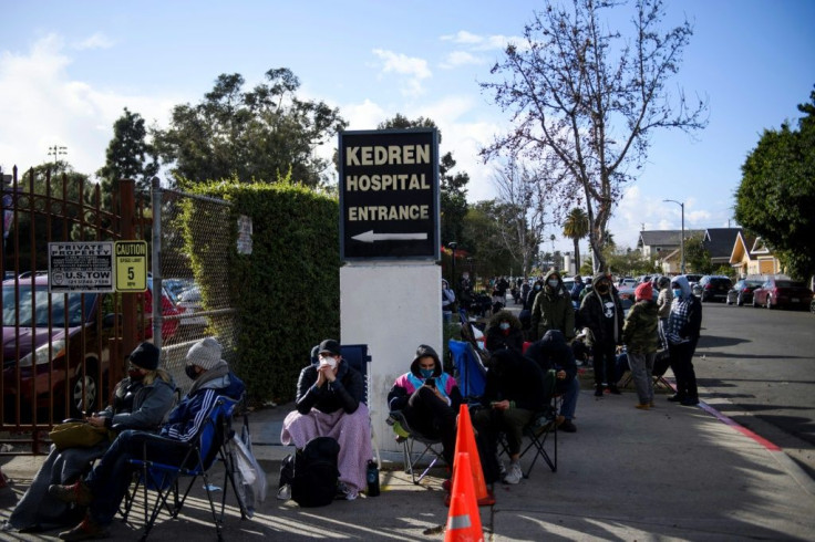 People without appointments wait in line for the potential chance to receive a Covid-19 vaccination that would have otherwise been discarded at the Kedren Community Health Center on January 25, 2021 in Los Angeles