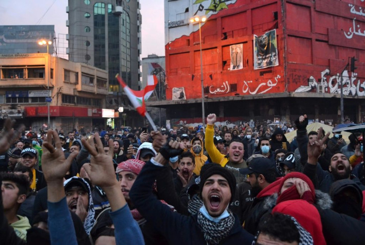 Lebanese protesters vent their anger by shouting slogans at Tripoli's Al-Nour Square, the scene of mass protests against the political class that began in late 2019