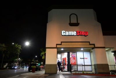 GameStop shares have soared in a clash between a new activist movement and hedge funds
