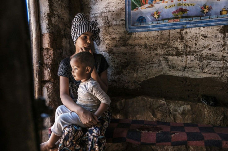 In the shadows: An Eritrean woman and her child at the Mai Aini refugee camp in northern Ethiopia