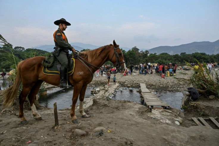A Colombian mounted police officer stands guard along the 'trochas' -illegal trails on the border between Cucuta in Colombia and San Antonio del Tachira in Venezuela, in April 2019. Colombia is now to offer temporary protected status to around one million