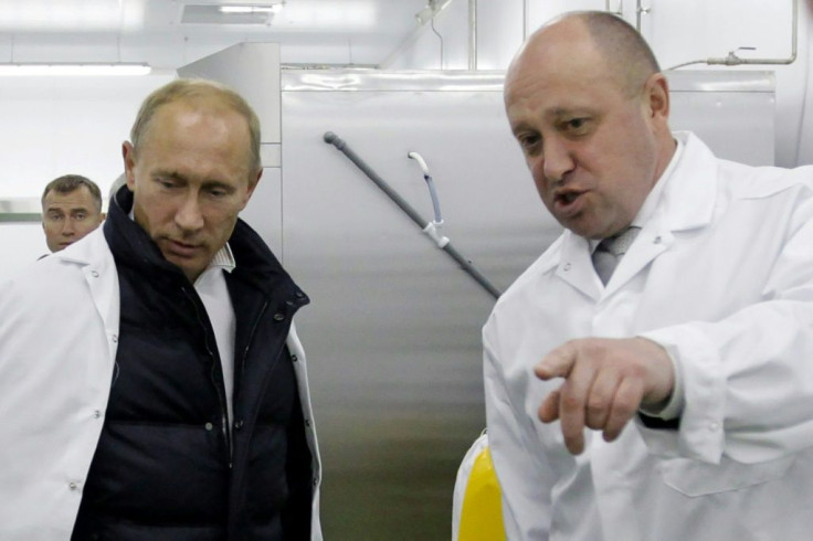 Russian President Vladimir Putin (l) with businessman Yevgeny Prigozhin, dubbed 'Putin's chef'