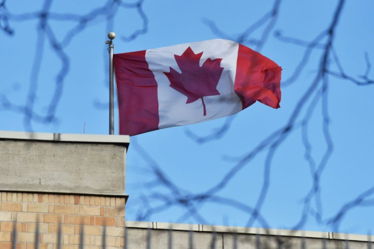 The Canadian flag flies over the Canadian embassy in Beijing: Canadian MPs have voted overwhelmingly to label China's treatment of its Uighur minority a 'genocide'