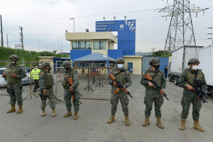 Security forces guard a prison in Ecuador, where dozens of inmates died in riots