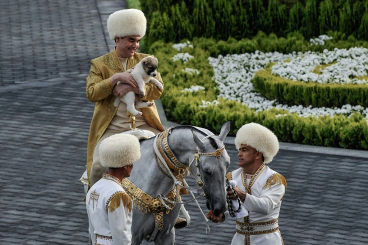 Turkmenistan's President Gurbanguly Berdymukhamedov holds a Turkmen shepherd dog, locally known as alabai