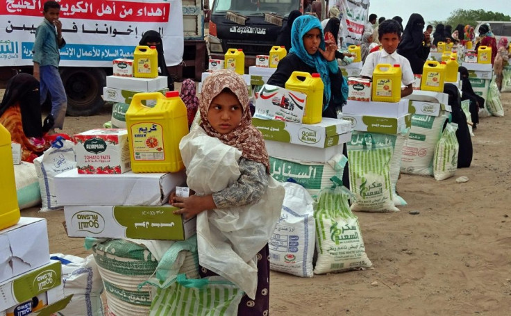 Displaced Yemenis receive food aid donated by a Kuwaiti charity in the western province of Hodeida on February 22, 2021. With aid funding dropping in 2020 amid the coronavirus downturn, the situation in the country has become even more dire