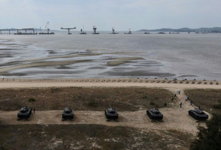 A US missile destroyer sailed through the Taiwan Strait Thursday, the third such voyage since President Joe Biden took office