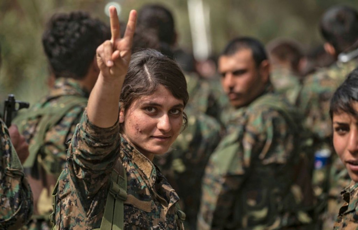 Kurdish female fighters have ended up running a Syrian camp filled with their former Islamic State enemies' wives and children