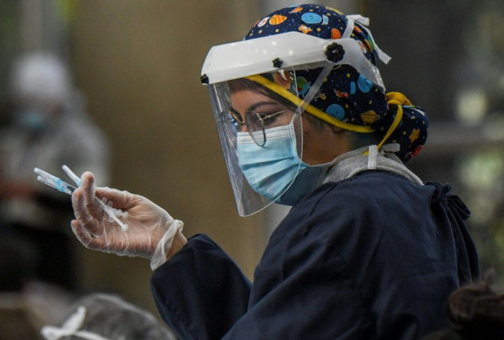 A nurse prepares shots of the CoronaVac vaccine developed by China's Sinovac lab in Bogota