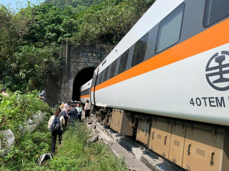Officials said the accident could have been caused by a maintenance vehicle sliding down an embankment and striking the train before it entered the tunnel near the coastal city of Hualien