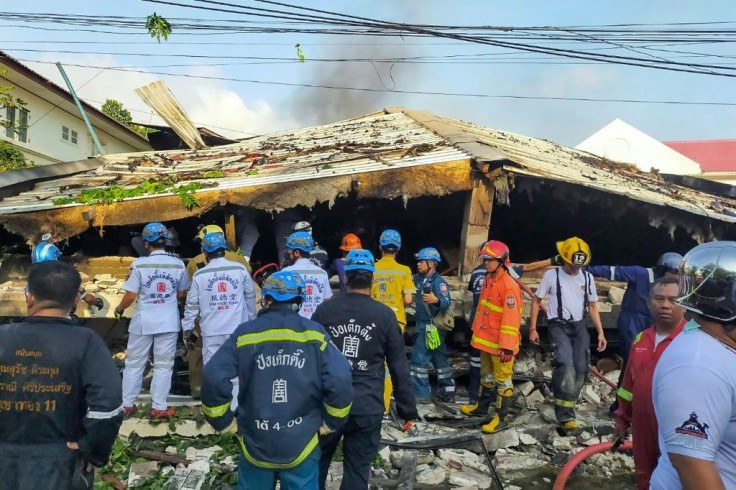 The three-story house, located in a luxury gated community in western Bangkok, was engulfed in flames