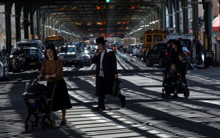 Members of New York's Orthodox Jewish community walking in Brooklyn ahead of last week's Passover celebrations