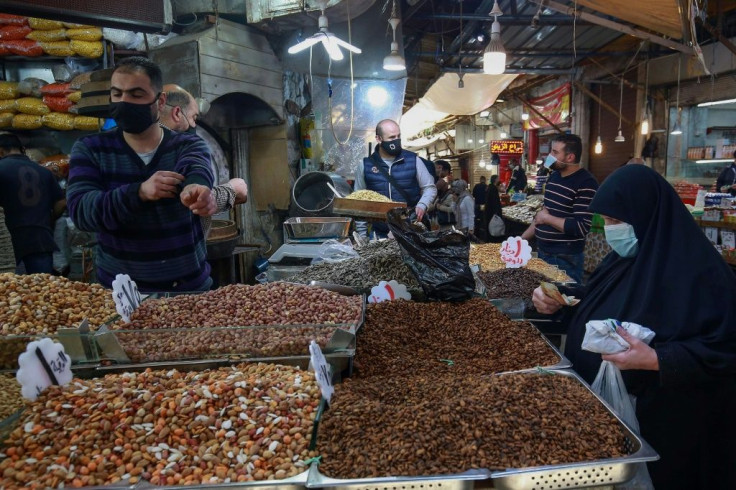 People shop in Jordan's capital Amman on April 5;  ordinary Jordanians say a reporting blackout on matters of the royal family mean they hear little news on the matter