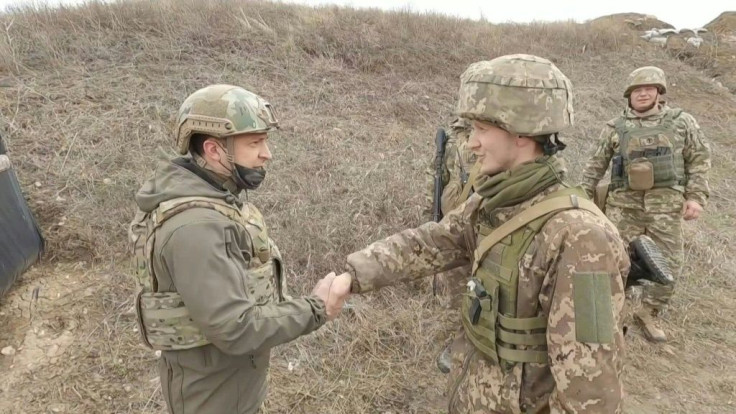 Ukraine's Zelensky on frontline as Merkel urges Putin to pull back troops