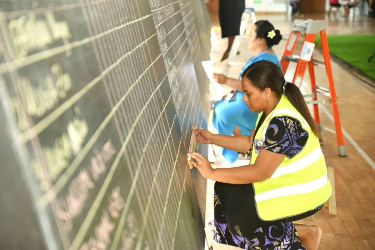Samoa election workers tally votes. Opposition leader Fiame Naomi Mataafa could become the island's first female leader with her new party tied with the prime minister's and a lone independent holding the balance of power