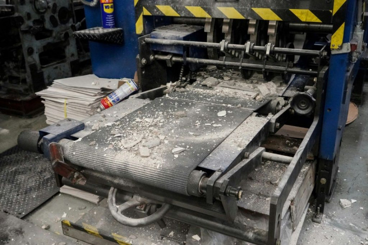 The paper's printing press was damaged by a group of masked men who stormed into its printing plant