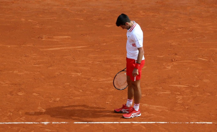 Shock defeat: Novak Djokovic on his way to a third round loss to Dan Evans in Monte Carlo