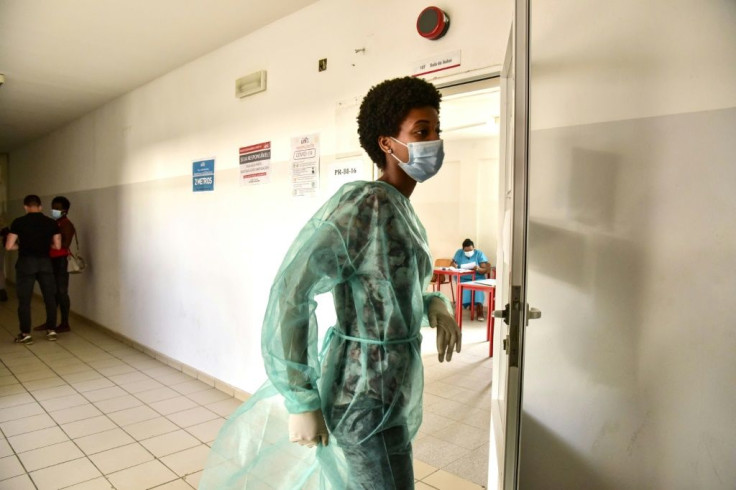 Poll workers wore protective personal equipment as Cape Verde battles a surge in coronavirus cases