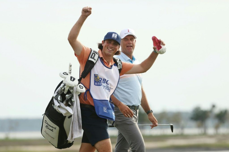 Winning combination: Stewart Cink, right, with son Reagan on the bag