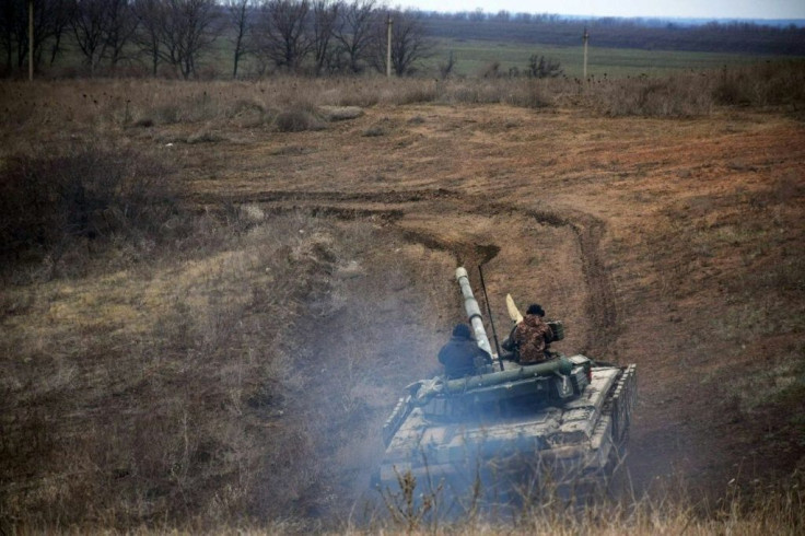 Ukrainian forces take part in a tank drill in Donbass region amid the largest deployment of Russian troops on Ukraine's borders since 2014