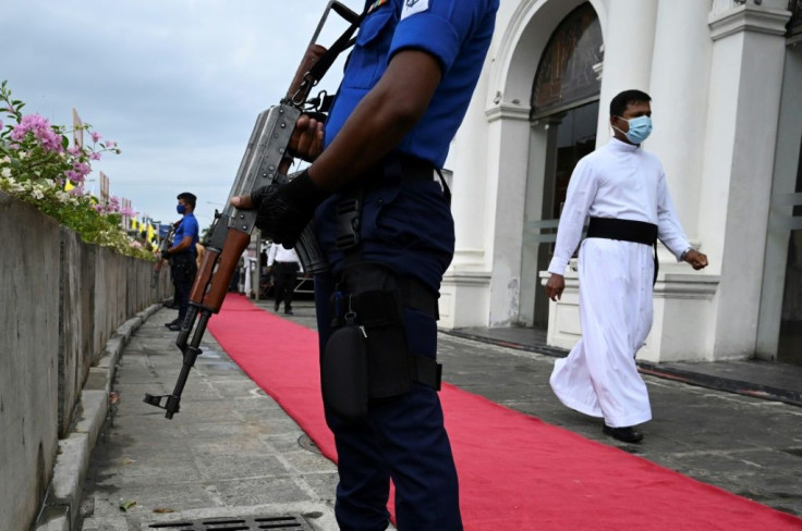 Navy personnel guard St. Anthony's Church during a service remembering Sri Lanka's Easter Sunday bombings in Colombo