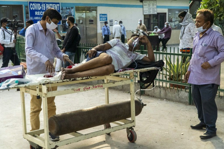 India's surge has seen it add about 350,000 cases and 2,600 deaths a day, and the healthcareÂ  system has been pushed to breaking point