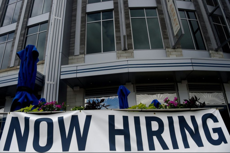 New filings for US unemployment aid dropped for the third straight week to a new pandemic low, indicating businesses may finally be recovering from the mass layoffs that began in March 2020