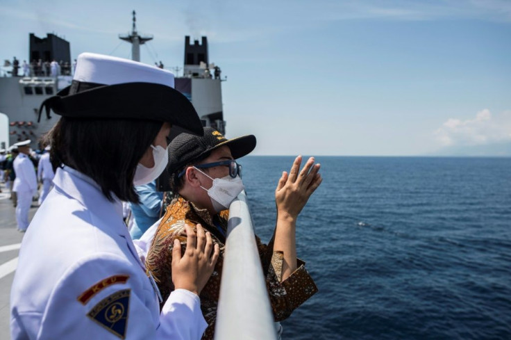 Naval officers pay their respects during a remembrance ceremony for the crew of the KRI Nanggala
