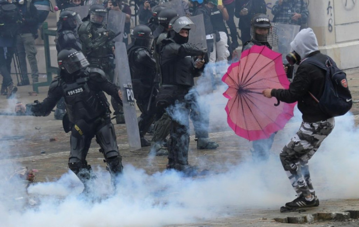 Demonstrators clash with police in Bogota, on April 28, 2021