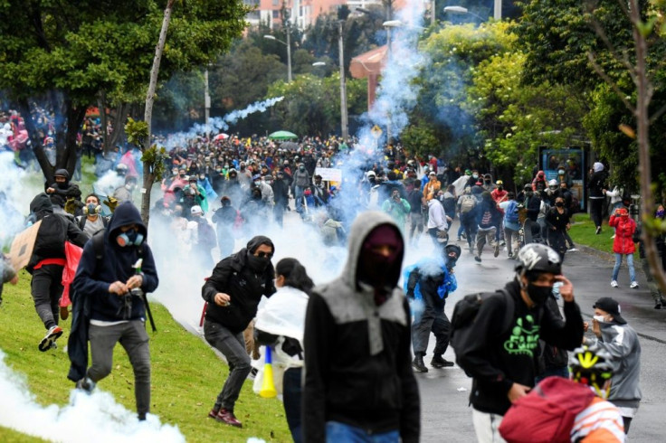 Demonstrators clash with riot outside Colombian President Ivan Duque's house in Bogota on May 1, 2021