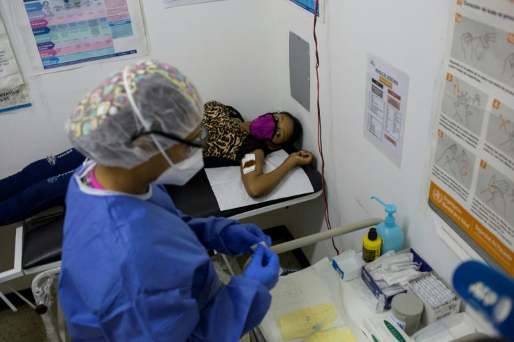 Nurse Erika Fernandez prepares to insert a contraceptive implant in teenager Deiglis