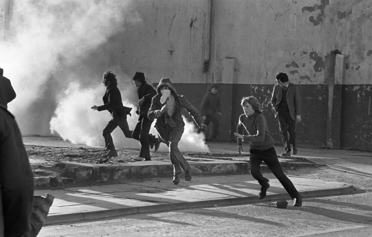 Young Catholics throw stones at British soldiers on the streets of Derry/Londonderry in 1972