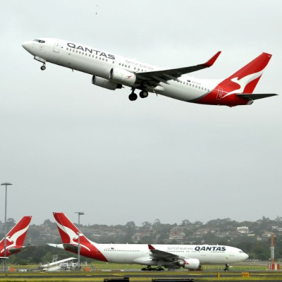 Australia's competition regulator said it would block a pricing, code-sharing and scheduling deal between Qantas and Japan Airlines because it would likely mean higher fares for passengers